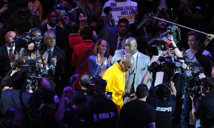 Los Angeles Lakers Kobe Bryant gets a pat on the head by Magic Johnson as he is introduced before his last game against the Utah Jazz at Staples Center in Los Angeles on April 13, 2016.  LAP20160413808 LORIxSHEPLER