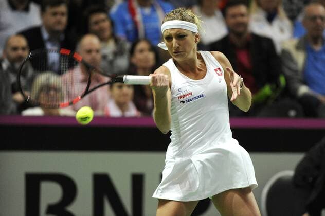 16.04.2016. Messe Luzern, Lucerne, Switzerland. Fed Cup Semi Final. Switzerland Versus Czech Republic. Timea Bacsinszky in action in the match with Barbora Strycova of the Czech Republic xDavidxEmmx  ActionPlus11728469