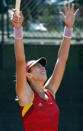 Federation Cup Spanish team s member Garbine Muguruza celebrates after defeating Italian Francesca Schiavone after their game as part of Federation Cup s World Group play-off at Lleida tennis club, northeastern Spain, 16 April 2016. Muguruza won 7-6 (4) and 6-0. Spain vs. Italy !ACHTUNG: NUR REDAKTIONELLE NUTZUNG!  20160416-635964178001672659