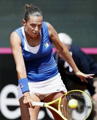 Italian Federation Cup team s member Roberta Vinci hits the ball against Spaniard Garbine Muguruza during the third match of Federation Cup s World Group play-off round at Lleida tennis club, northeastern Spain, 17 April 2016. Muguruza won 6-2 and 6-2 for Spain defeates Italy in the play-off round after winning three matches. EFE Andreu Dalmau Spain vs. Italy !ACHTUNG: NUR REDAKTIONELLE NUTZUNG!  20160417-635965009822313327