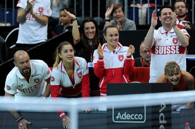 17.04.2016. Messe Luzern, Lucerne, Switzerland. Fed Cup Semi Final. Switzerland Versus Czech Republic. Belinda Bencic, Martina Hingis and Timea Bacsinszky of Switzerland cheer on from the bench during the match between Viktorija Golubic of Switzerland and Barbora Strycova of the Czech Republic xDavidxEmmx  ActionPlus11729290