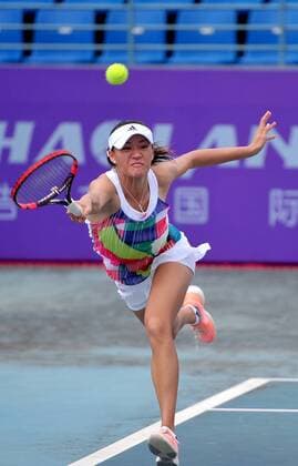 Xu Shilin of China returns a shot to Riko Sawayanagi of Japan in their women s singles match during the 2016 ITF Women s Circuit - Nanning in Nanning city, south China s Guangdong province, 21 April 2016. Xu Shilin was defeated by Riko Sawayanagi 1-2 (3-6, 6-0, 3-6). Riko Sawayanagi eliminates Xu Shilin at ITF Women s Circuit - Nanning  pbu434959_08