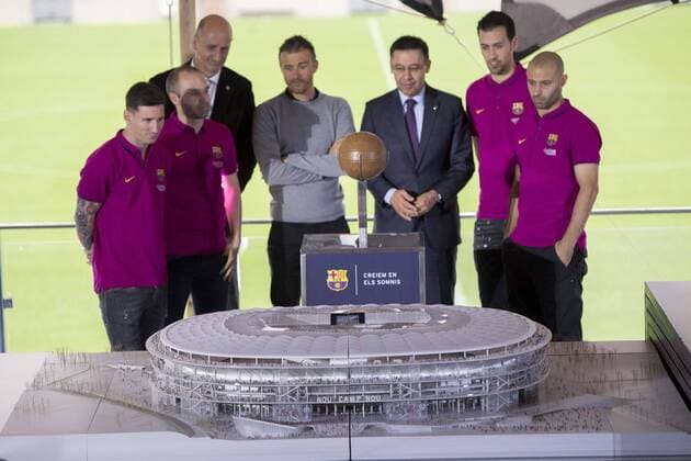 April 21, 2016 - Barcelona, Spain - Barcelona s Argentinian forward Lionel Messi, Barcelona s midfielder Andres Iniesta, Barcelona s Espai Barca (Barca Space) director Jordi Moix, Barcelona s coach Luis Enrique, Barcelona s president Josep Maria Bartomeu, Barcelona s midfielder Sergio Busquets and Barcelona s Argentinian defender Javier Mascherano push a ball to uncover a mockup of the New Camp Nou during the presentation of FC Barcelona Barca stadium s remodelling project, at the at the Camp Nou stadium in Barcelona, on April 21, 2016 New Camp Nou stadium maquet show - ZUMAn230