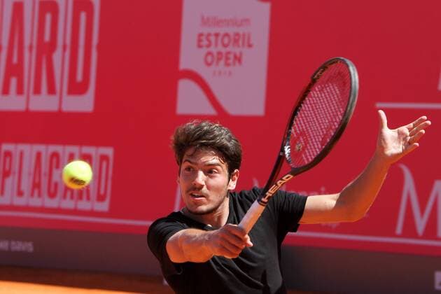 April 23, 2016 - Estoril, Portugal - Jo¹o Domingues of Portugal returns a ball to Franko Skugor of Croatia during the Qualifying of the Millennium Estoril Open ATP Tennis Herren 250 tennis tournament at the Clube de TÅ½nis do Estoril in Portugal on April 25, 2016. Millennium Estoril Open ATP 250 tennis tournament - Jo‹o Domingues (POR) vs Franko Skugor (CRO) - ZUMAf123
