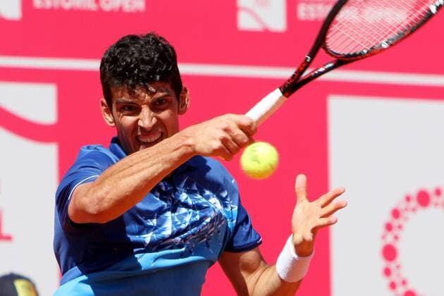April 23, 2016 - Estoril, Portugal - Franko Skugor of Croatia returns a ball to Joo Domingues of Portugal during the Qualifying of the Millennium Estoril Open ATP Tennis Herren 250 tennis tournament at the Clube de Tnis do Estoril in Portugal on April 25, 2016. Millennium Estoril Open  - ZUMAn230