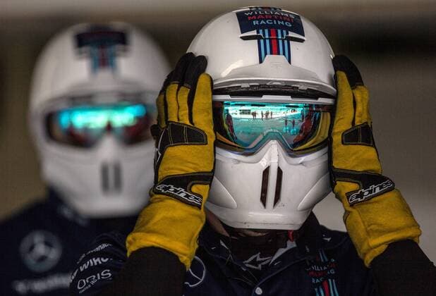 SOCHI, RUSSIA. APRIL 28, 2016. A mechanic and a test driver of Williams Martini Racing F1 team with a racing car at the Sochi Autodrom racing circuit ahead of the 2016 Formula 1 Russian Grand Prix. Sergei Savostyanov TASS  TS021245