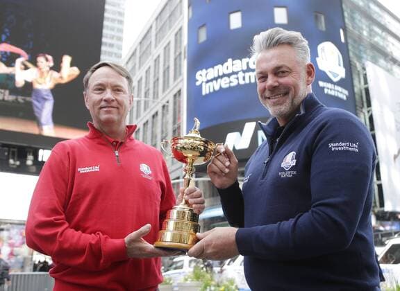 Ryder Cup Captains Davis Love III and Darren Clarke hold the The Ryder Cup trophy in Times Square after they ring the opening bell at the Nasdaq in New York City on April 28, 2016.  NYP20160428105 JOHNxANGELILLO