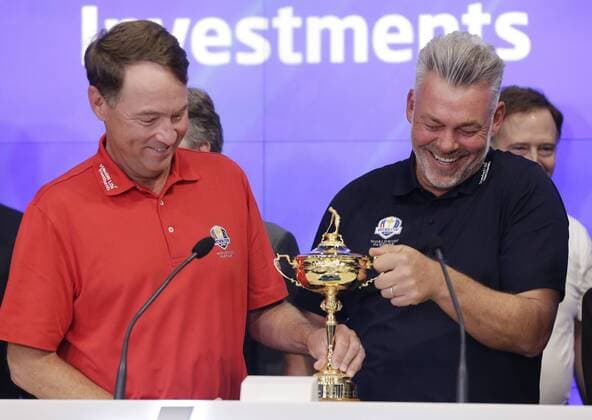 Ryder Cup Captains Davis Love III and Darren Clarke hold the The Ryder Cup trophy when they ring the opening bell at the Nasdaq in Times Square in New York City on April 28, 2016.  NYP20160428107 JOHNxANGELILLO