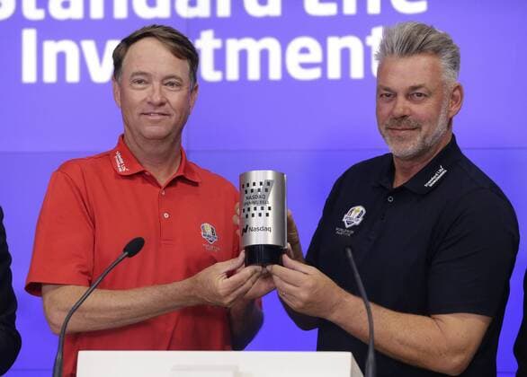 Ryder Cup Captains Davis Love III and Darren Clarke ring the opening bell at the Nasdaq in Times Square in New York City on April 28, 2016.  NYP20160428111 JOHNxANGELILLO