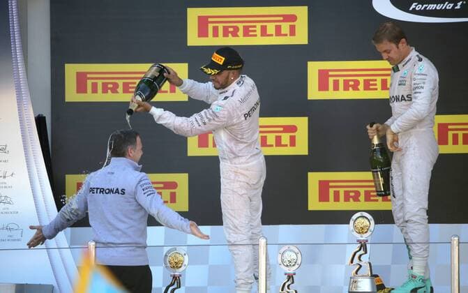 SOCHI, RUSSIA. MAY 1, 2016. 2nd placed British driver Lewis Hamilton of the Mercedes AMG Petronas F1 team and German driver Nico Rosberg (L-R background) of the Mercedes AMG Petronas F1 team, the winner of the 2016 Formula 1 Russian Grand Prix, at an awards ceremony, at the Sochi Autodrom Circuit in Olympic Park. Mikhail Metzel TASS  TS0217D9