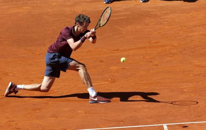 Russian tennis player Andrey Kuznetsov returns the ball to Spanish Rafael Nadal during their Mutua Madrud Open match held at Caja Magica court in Madrid, Spain, 3 May 2016. Nadal won 6-3, 6-3. RAFAEL NADAL VS ANDREY KUZNETSOV !ACHTUNG: NUR REDAKTIONELLE NUTZUNG!  MAD008 20160503-635979020364969559