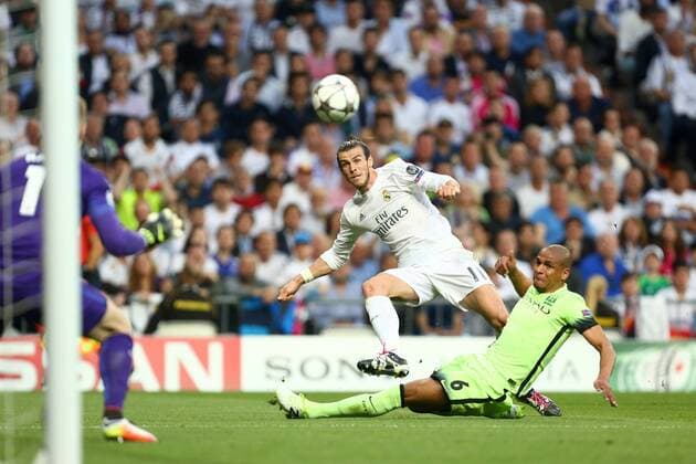 Gareth Bale of Real Madrid scores the opening goal during the UEFA Champions League Semi Final 2nd leg match at the Santiago Bernabeu stadium. Photo credit should read: Philip Oldham Sportimage EDITORIAL USE ONLY. No use with unauthorised audio, video, data, fixture lists, club league logos or live services. Online in-match use limited to 120 images, no video emulation. No use in betting, games or single club league player publications.
