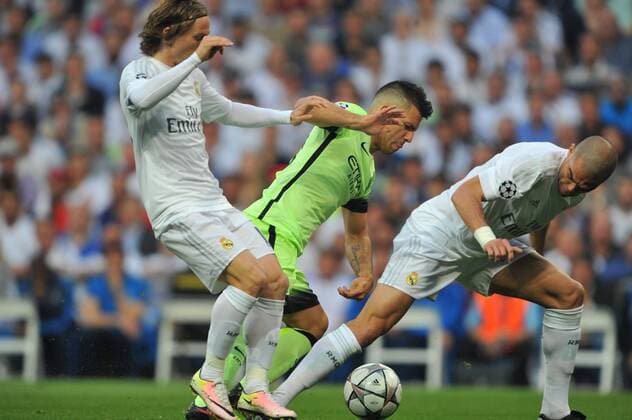 Luka Modric (Real Madrid), Sergio Aguero (Manchester City FC) and Pepe (Real Madrid) compete for the ball during the UEFA Champions League semifinal match between Real Madrid and Manchester City played at Estadio Santiago Bernabeu, Madrid -  xJ.M.Colomox xx