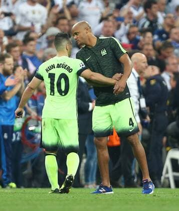 Vincent Kompany of Manchester City consoles Sergio Aguero during the UEFA Champions League Semi Final 2nd leg match at the Santiago Bernabeu stadium. Photo credit should read: Philip Oldham Sportimage EDITORIAL USE ONLY. No use with unauthorised audio, video, data, fixture lists, club league logos or live services. Online in-match use limited to 120 images, no video emulation. No use in betting, games or single club league player publications.
