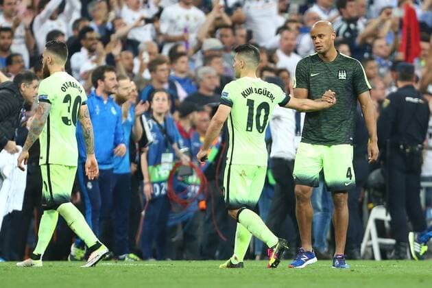 Vincent Kompany of Manchester City consoles Sergio Aguero during the UEFA Champions League Semi Final 2nd leg match at the Santiago Bernabeu stadium. Photo credit should read: Philip Oldham Sportimage EDITORIAL USE ONLY. No use with unauthorised audio, video, data, fixture lists, club league logos or live services. Online in-match use limited to 120 images, no video emulation. No use in betting, games or single club league player publications.