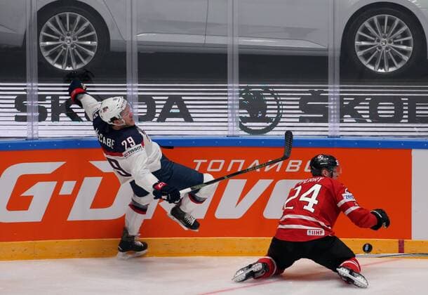 ST. PETERSBURG, RUSSIA. MAY 6, 2016. United States Jake McCabe (L) and Canada s Corey Perry fight for the puck in their 2016 IIHF World Championship WM Weltmeisterschaft Preliminary Round Group B Ice hockey Eishockey match at the Yubileyny Sports Palace. Sergei Savostyanov TASS  TS021D3C