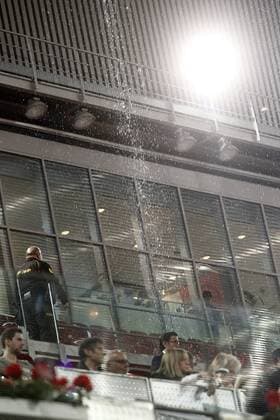 A cascade of water seeps through the roof of the Principal Court on the Caja Magica (Magic Box) during Madrid Open Tennis 2016 match.May, 6, 2016.  (20160506155)