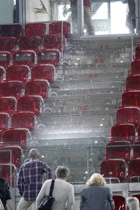 A cascade of water seeps through the roof of the Principal Court on the Caja Magica (Magic Box) during Madrid Open Tennis 2016 match.May, 6, 2016.  (20160506134)