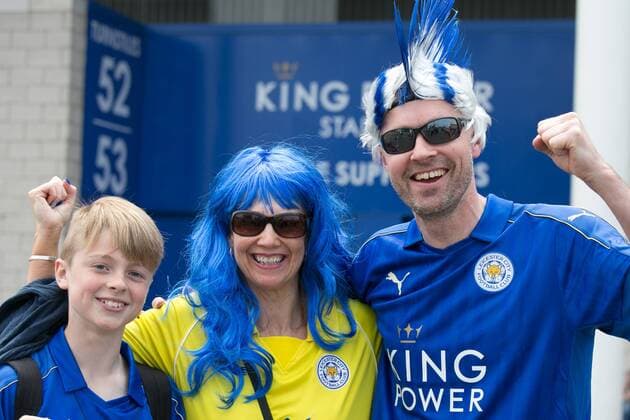 May 7, 2016 - Leicester, Leicestershire, UK - Leicester, UK. Leicester City fans celebrating outside the King Power stadium before their match with Everton before lifting the Premiership trophy. Pictured, a family enjoying the special day. Leicester City Premier League Coronation  - ZUMAl94_