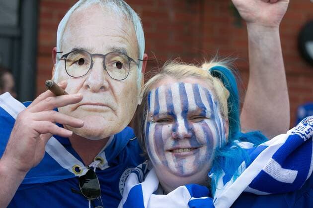 May 7, 2016 - Leicester, Leicestershire, UK - Leicester, UK. Leicester City fans celebrating outside the King Power stadium before their match with Everton before lifting the Premiership trophy. Pictured, a cigar smoking manager and a fan. Leicester City Premier League Coronation  - ZUMAl94_