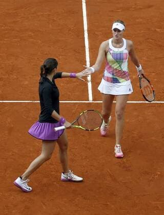 French tennis players Caroline Garcia (L) and Kristina Mladenovic (R) jubilate a point against Sania Mirza and Martina Higins during their Mutua Madrid Open double female final match played at Caja Magica tennis complex in Madrid, Spain, on 07 May 2016. Garcia and Mladenovic won 6-4 and 6-4. Caroline Garcia and Kristina Mladenovic vs Sania Mirza and Martina Higins !ACHTUNG: NUR REDAKTIONELLE NUTZUNG!  20160507-635982427268367464