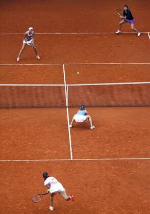 French tennis players Caroline Garcia (R-up) and Kristina Mladenovic (L-up ) jubilate a point against Sania Mirza (L-down) and Martina Higins (C) during their Mutua Madrid Open double female final match played at Caja Magica tennis complex in Madrid, Spain, on 07 May 2016. Garcia and Mladenovic won 6-4 and 6-4. Caroline Garcia and Kristina Mladenovic vs Sania Mirza and Martina Higins !ACHTUNG: NUR REDAKTIONELLE NUTZUNG!  20160507-635982427916547464