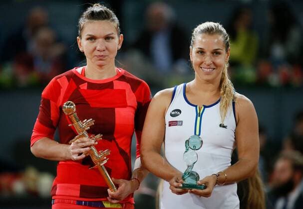 Rumanian tennis player Simona Halep (L) celebrates with the trophy her victory 6-2 and 6-4 against Slovak Dominika Cibulkova (R) during their Mutua Madrid Open female final match played at Caja Magica tennis complex in Madrid, Spain, on 07 May 2016. Dominika Cibulkova vs Simona Halep !ACHTUNG: NUR REDAKTIONELLE NUTZUNG!  20160507-635982485129021526