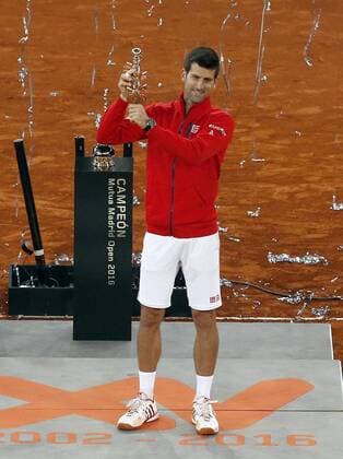 Serbian tennis player Novak Djokovic celebrates with the trophy his victory 6-2, 3-6 and 6-3 against Scottish Andy Murray during their Mutua Madrid Open male final match played at the Caja Magica tennis complex in Madrid, Spain, on 08 May 2016. Novak Djokovic vs Andy Murray !ACHTUNG: NUR REDAKTIONELLE NUTZUNG!  20160508-635983397642488025