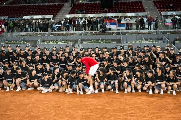 Serbian Novak Djokovic pose for the media with all the ball boys during TPA Finals Mutua Madrid Open Tennis 2016 in Madrid, May 08, 2016.  (20160508170)