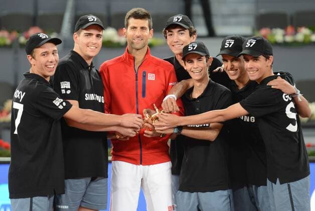 May 8, 2016 - Madrid, Spain - NOVAK DJOKOVIC poses with ball boys after winning the the Mutua Madrid Open. Tennis 2016 - Mutua Madrid Open - Day 9 - ZUMAl132