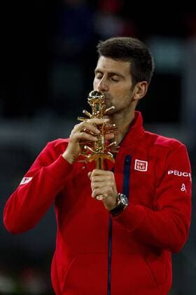 May 8, 2016 - Madrid, Madrid, Spain - Novak Djokovic from Serbia kisses his trophy after winning the Madrid Open tennis tournament, men s final match against Andy Murray from Great Britain in Madrid, Spain, Sunday, May 8, 2016. Djokovic won 6-2, 3-6 and 6-3 Mutua Madrid Open - Day Nine  - ZUMAn230