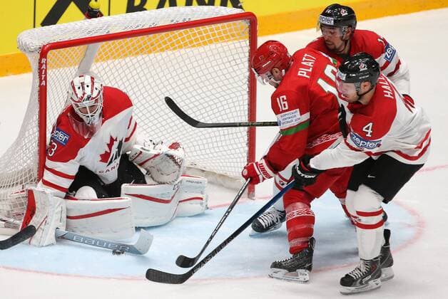 ST. PETERSBURG, RUSSIA. MAY 9, 2016. Canada s goalie Cam Talbot (L), Taylor Hall, Matt Dumba (R-L) defend against Belarus Geoff Platt (2nd L) in their 2016 IIHF World Championship WM Weltmeisterschaft Preliminary Round Group B Ice hockey Eishockey match at the Yubileyny Sports Palace. Team Canada won the game 8-0. Sergei Savostyanov TASS  TS0223A8