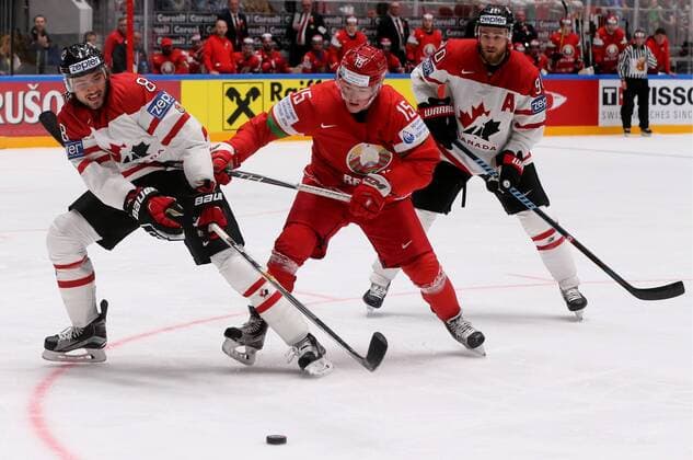 ST. PETERSBURG, RUSSIA. MAY 9, 2016. Canada s Chris Tanev (L), Ryan O Reilly (R) and Belarus Artyom Demkov (C) fight for ther puck in their 2016 IIHF World Championship WM Weltmeisterschaft Preliminary Round Group B Ice hockey Eishockey match at the Yubileyny Sports Palace. Team Canada won the game 8-0. Alexander Demianchuk TASS  TS0223D4