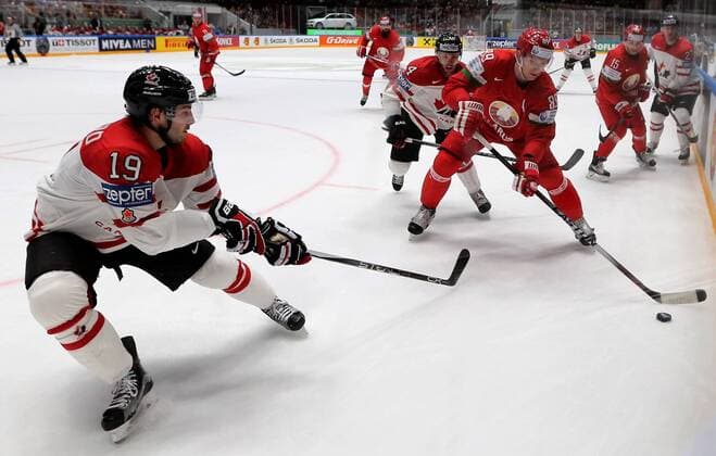 ST. PETERSBURG, RUSSIA. MAY 9, 2016. Canada s Derick Brassard, Taylor Hall and Belarus Dmitry Korobov (L-R) fight for the puck in their 2016 IIHF World Championship WM Weltmeisterschaft Preliminary Round Group B Ice hockey Eishockey match at the Yubileyny Sports Palace. Team Canada won the game 8-0. Alexander Demianchuk TASS  TS0223A9