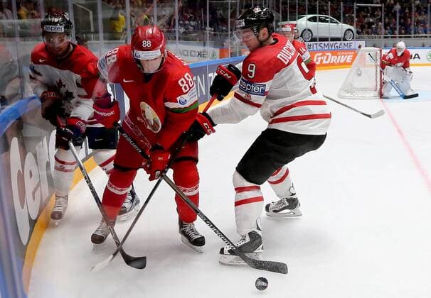 ST. PETERSBURG, RUSSIA. MAY 9, 2016. Canada s Max Domi (L), Matt Duchene (R) and Belarus Yevgeny Kovyrshin (C) fight for the puck in their 2016 IIHF World Championship WM Weltmeisterschaft Preliminary Round Group B Ice hockey Eishockey match at the Yubileyny Sports Palace. Team Canada won the game 8-0. Alexander Demianchuk TASS  TS02241E
