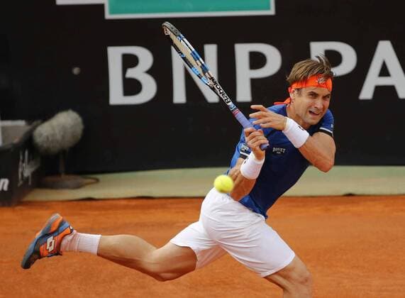Italy: Tennis BNL Rome 2016 David Ferrer of Spain returns the ball during first round match of the Italian Open tennis BNL2016 tournament against Filippo Volandri of Italy at the Foro Italico.  CiroxDexLuca