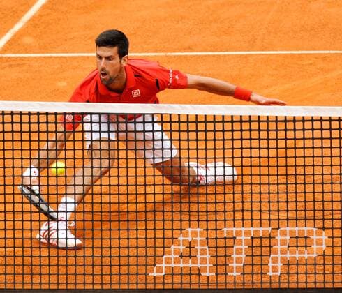 11.05.2016. Rome, Italy. BNL d Italia Tennis Tournament. Novak Djokovic (SRB) versus Stephane Robert (FRA). Novak Djokovic digs deep at the net xactivaxfotox  ActionPlus11735864