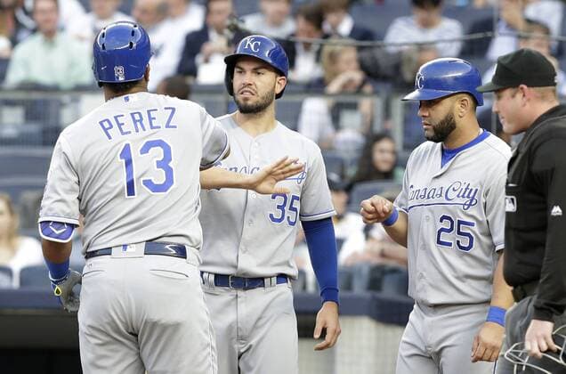Kansas City Royals Salvador Perez celebrates with Kendrys Morales and Eric Hosmer after he hits a 3-run home run in the first inning against the New York Yankees at Yankee Stadium in New York City on May 11, 2016.  NYP20160511107 JOHNxANGELILLO