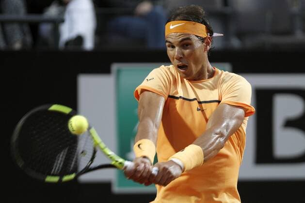 Italy: Open Tennis Tournament - Wednesday May 11 Spain s Rafael Nadal returns the ball to Germany s Philipp Kohlschreiber at the Italian Open tennis tournament.  IsabellaxBonotto