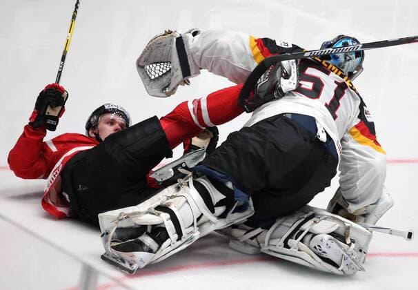 ST PETERSBURG, RUSSIA. MAY 12, 2016. Canada s Connor McDavid (L) and Germany s goaltender Timo Pielmeier (51) in their 2016 IIHF Ice hockey Eishockey WM Nationalteam LÃ¤nderspiel World Championships Group B Preliminary Round match at Yubileiny Arena. Canada won 5-2. Sergei Savostyanov TASS  TS022AFB