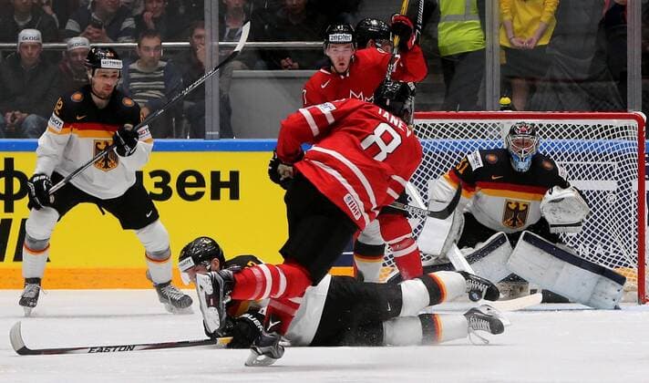 ST. PETERSBURG, RUSSIA. MAY 12, 2016. Germany s Sinan Akdag, Philip Gogulla, Canada s Chris Tanev, Connor McDavid and Germany s goalie Timo Pielmeier (L-R) in action in their 2016 IIHF World Championship WM Weltmeisterschaft Preliminary Round Group B Ice hockey Eishockey match at Yubileyny Sports Palace. Team Canada won the game 5:2. Alexander Demianchuk TASS  TS022B51