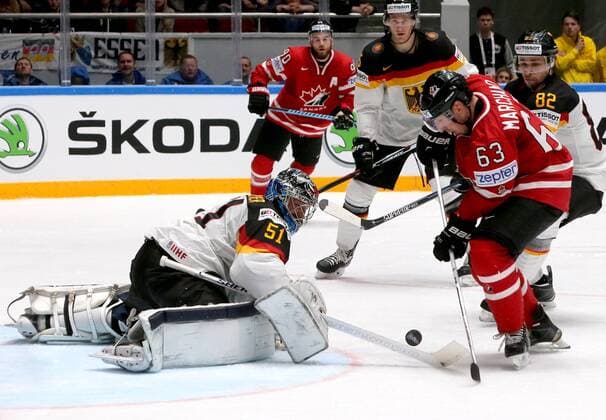 ST. PETERSBURG, RUSSIA. MAY 12, 2016. Germany s goalie Timo Pielmeier, Canada s Ryan O Reilly (L-R), Germany s Sinan Akdag and Canada s Brad Marchand (L-R) in action in their 2016 IIHF World Championship WM Weltmeisterschaft Preliminary Round Group B Ice hockey Eishockey match at Yubileyny Sports Palace. Team Canada won the game 5:2. Alexander Demianchuk TASS  TS022B56