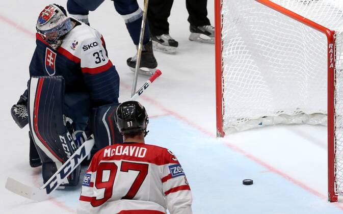 ST. PETERSBURG, RUSSIA. MAY 14, 2016. Slovakia s goalie Julius Hudacek (L) concedes a goal in their 2016 IIHF World Championship WM Weltmeisterschaft Preliminary Round Group B Ice hockey Eishockey match against Canada at the Yubileyny Sports Palace. Team Canada won the game 5-0. Alexander Demianchuk TASS  TS022FBB