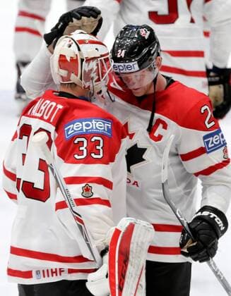 ST. PETERSBURG, RUSSIA. MAY 14, 2016. Canada s goalie Cam Talbot (L) and Corey Perry celebrate winning their 2016 IIHF World Championship WM Weltmeisterschaft Preliminary Round Group B Ice hockey Eishockey match against Slovakia at the Yubileyny Sports Palace. Team Canada won the game 5-0. Alexander Demianchuk TASS  TS022FBF