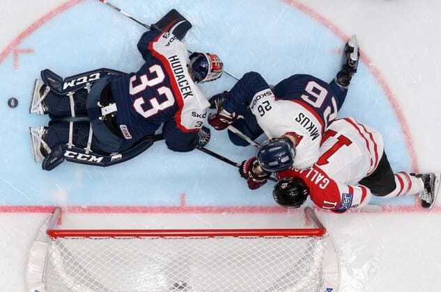 ST. PETERSBURG, RUSSIA. MAY 14, 2016. Slovakia s goalie Julius Hudacek, Juraj Mikus defend against Canada s Brendan Gallagher (L-R) in their 2016 IIHF World Championship WM Weltmeisterschaft Preliminary Round Group B Ice hockey Eishockey match at the Yubileyny Sports Palace. Team Canada won the game 5-0. Alexander Demianchuk TASS  TS022FC4