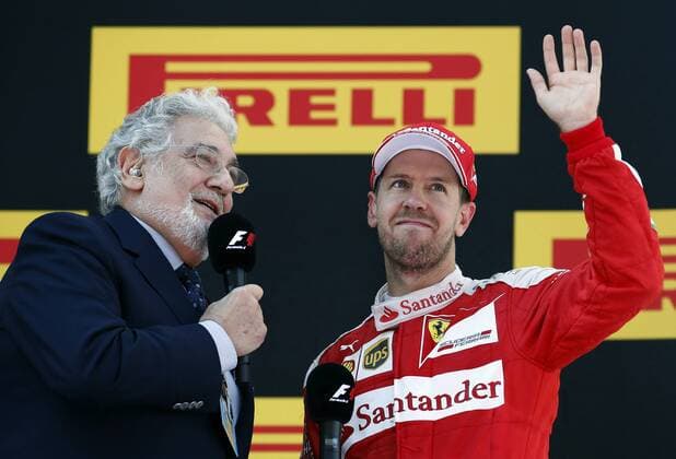 German Formula One driver Sebastian Vettel (R), Ferrari, celebrates his third place at the Spanish Formula One Grand Prix next to Spanish tenor Placido Domingo (L) at the Barcelona-Catalunya circuit in Barcelona, northeastern Spain, on 15 May 2016. SPANISH GRAND PRIX !ACHTUNG: NUR REDAKTIONELLE NUTZUNG!  20160515-635989308981527616