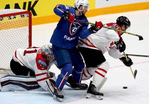 ST. PETERSBURG, RUSSIA. MAY 16, 2016. Canada s goalie Calvin Pickard (L), Morgan Rielly (R) and France s Loic Lamperier (C) in action in their 2016 IIHF World Championship WM Weltmeisterschaft Preliminary Round Group B Ice hockey Eishockey match at Yubileyny Sports Palace. Alexander Demianchuk TASS  TS02336D