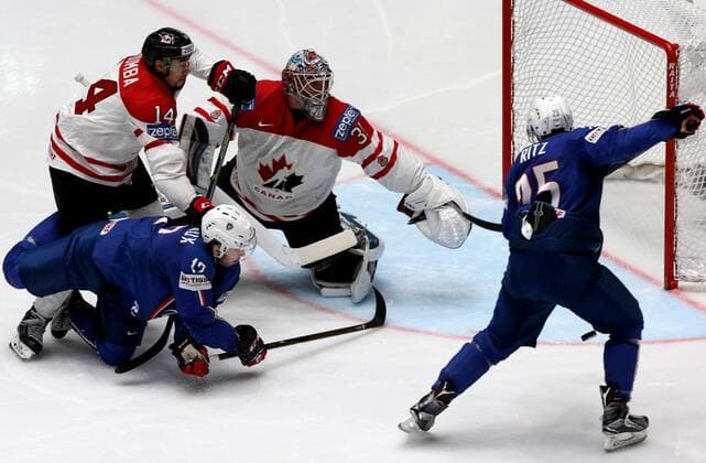 ST. PETERSBURG, RUSSIA. MAY 16, 2016. France s Valentin Claireaux (L blue), Nicolas Ritz (R blue), Canada s Matt Dumba (L white) and Canada s goalie Calvin Pickard (R white) in action in their 2016 IIHF World Championship WM Weltmeisterschaft Preliminary Round Group B Ice hockey Eishockey match at Yubileyny Sports Palace. The Canadian Team won the game 4:0. Alexander Demianchuk TASS  TS0233BF