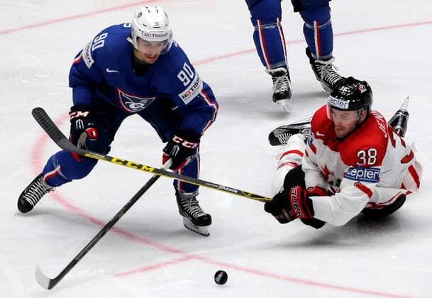 ST. PETERSBURG, RUSSIA. MAY 16, 2016. France s Maxime Moisand (L) and Canada s Boone Jenner in action in their 2016 IIHF World Championship WM Weltmeisterschaft Preliminary Round Group B Ice hockey Eishockey match at Yubileyny Sports Palace. The Canadian Team won the game 4:0. Alexander Demianchuk TASS  TS0233C8