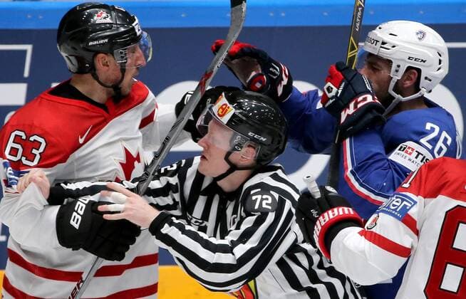 ST. PETERSBURG, RUSSIA. MAY 16, 2016. France s Benjamin Dieude Fauvel (R) and Canada s Brad Marchand (L) in their 2016 IIHF World Championship WM Weltmeisterschaft Preliminary Round Group B Ice hockey Eishockey match at Yubileyny Sports Palace. The Canadian Team won the game 4:0. Alexander Demianchuk TASS  TS0233CA